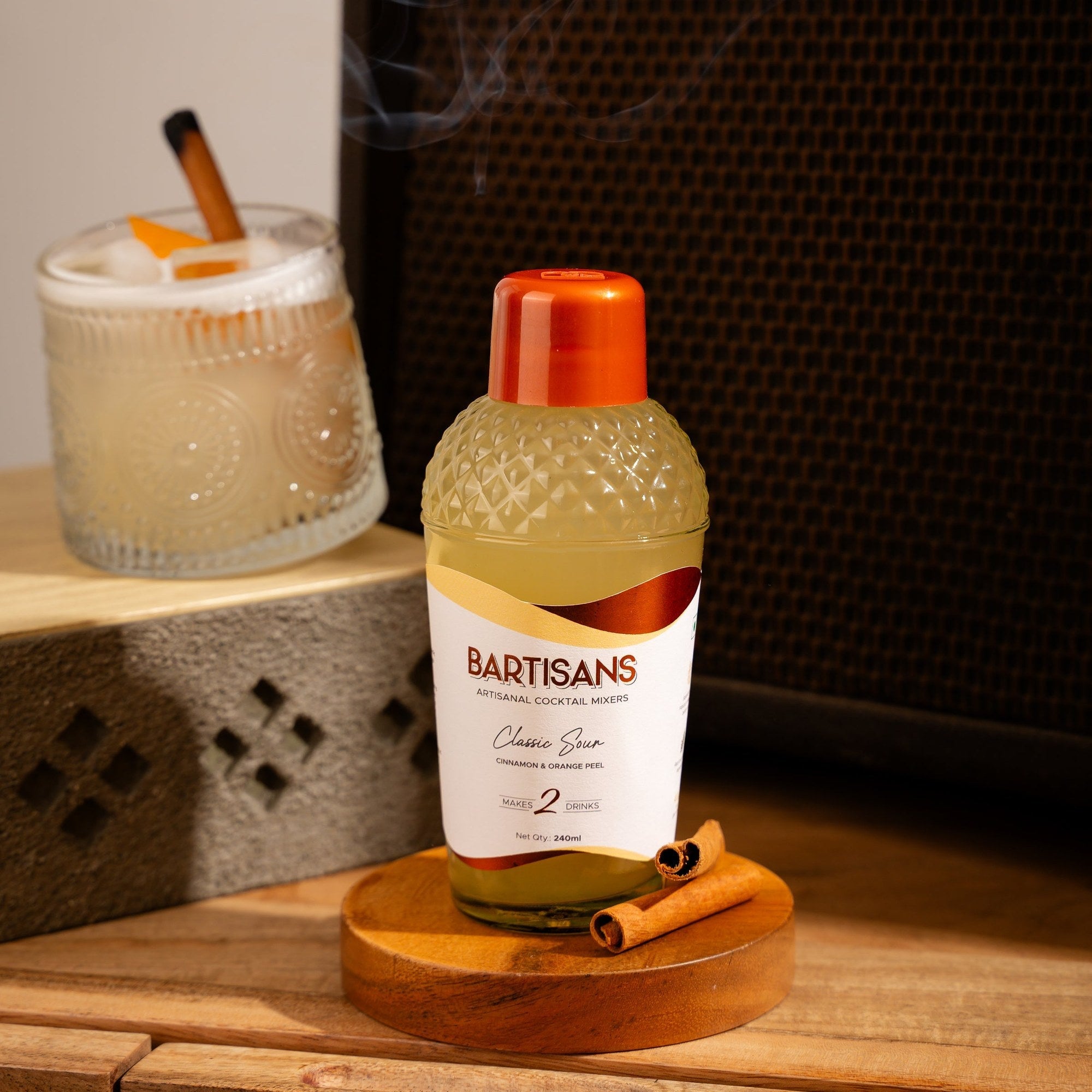  Classic Sour cocktail mixer bottle styled with a poured cocktail#Serve_2 Drinks 