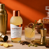 Liquid Gold cocktail mixer bottle styled with a poured cocktail#Serve_4 Drinks