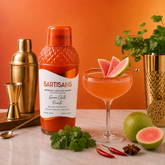 Guava Chilli Picante cocktail mixer bottle styled with a poured cocktail#Serve_4 Drinks