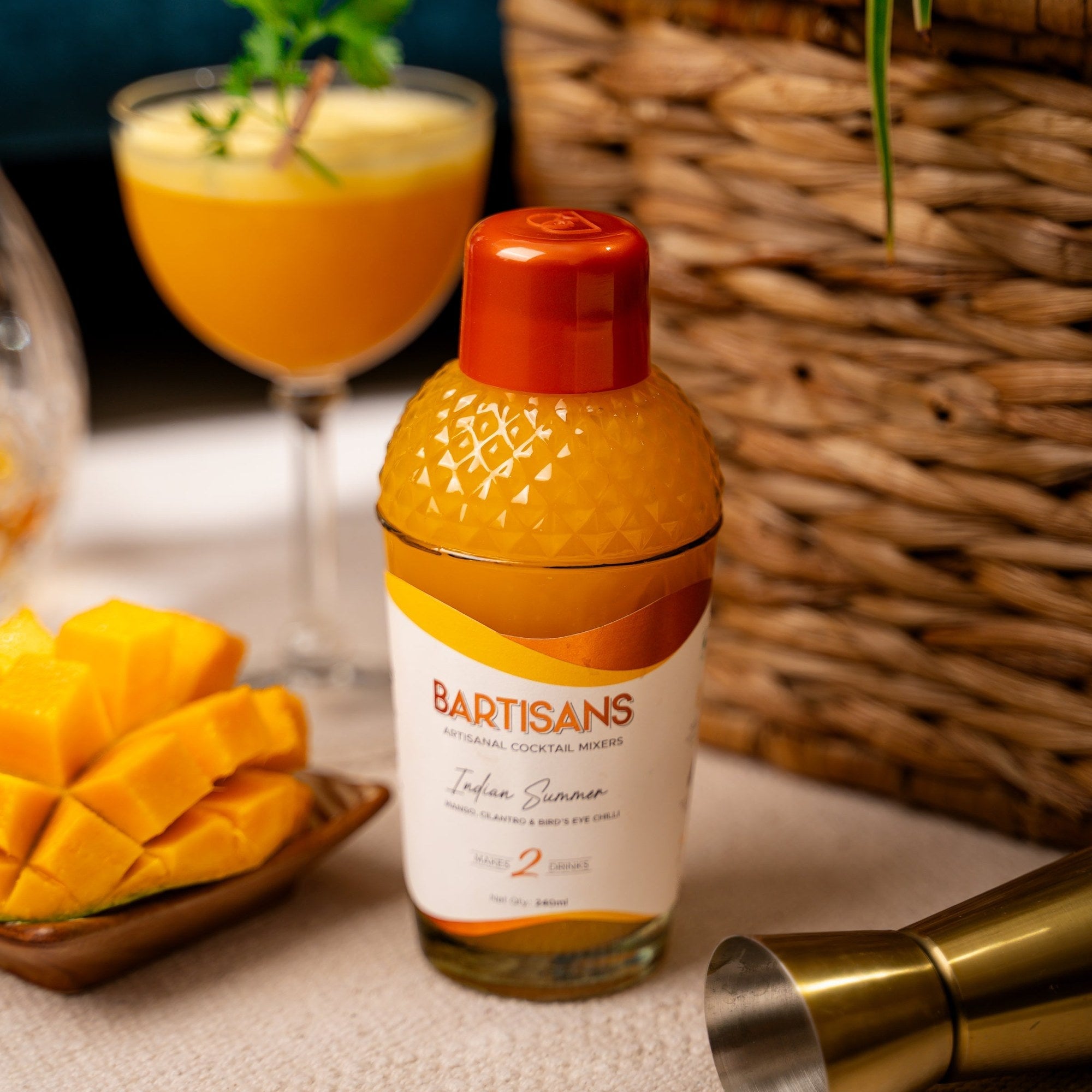  Indian Summer cocktail mixer bottle styled with a poured cocktail#Serve_2 Drinks 